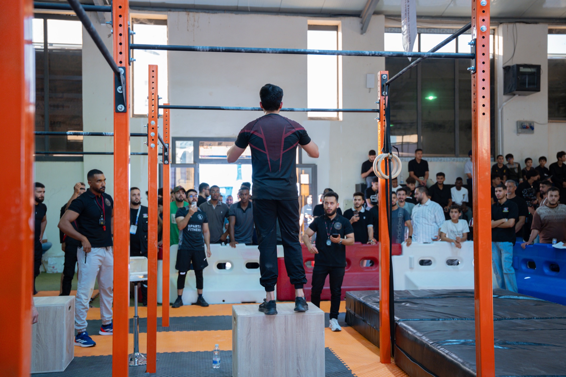 Calisthenics athlete performing in front of a crowd at Sportex
