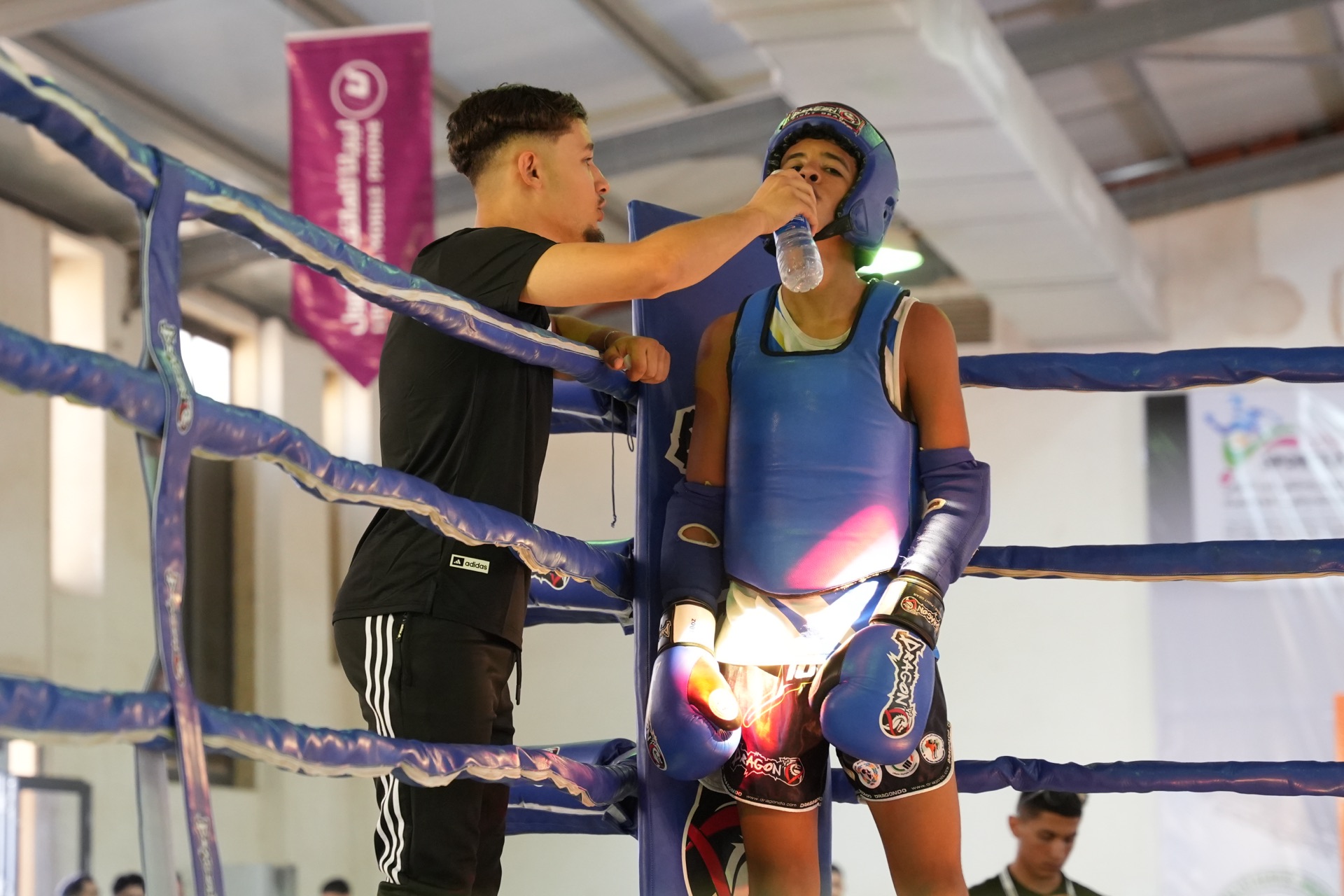 Young kickboxing athlete in the ring
